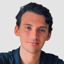 Charlie Clark headshot with white background.